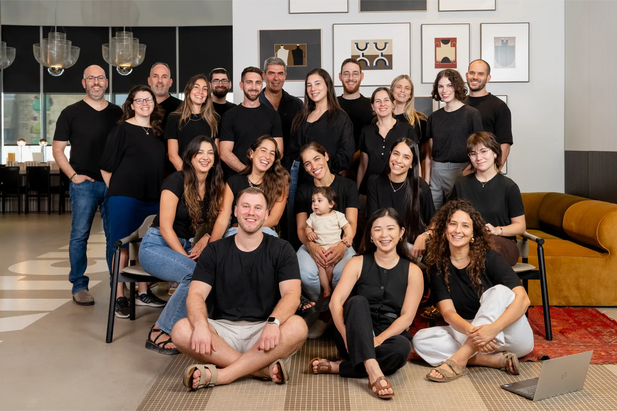 The Heka team, around two dozen people, gathered together for a group photo in the office.